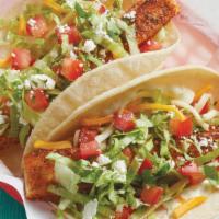 Grilled Mahi Taco · *FAN FAVORITE - Grilled Mahi served on a soft corn tortilla and topped with garlic sauce, le...