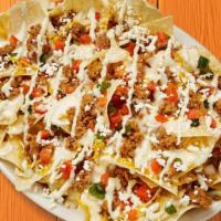 Seasoned Ground Beef Nachos · Fresh tortilla chips topped with special ground beef, shredded cheese, queso, feta, pico de ...