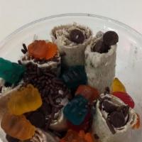 Rainbow Roll Ice Cream · Honey, fruity pebbles and sprinkles.