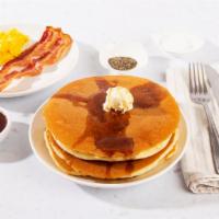 Pancake Combo · Two fluffy buttermilk pancakes served with maple syrup and powdered sugar, plus your choice ...