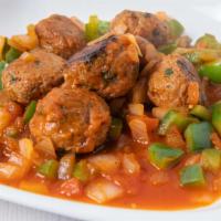 Meatless Meatball · Plant based meatballs-cilantro-onions-tomato sauce.