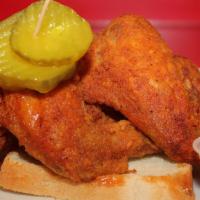 3 Nashville Hot Whole Wings · Whole Wings, White Bread Slices & pickle.