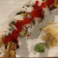 Spider Roll · Whole fried soft shell crab with avocado, crab meat and tobiko on top.