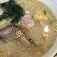 Tonkotsu Ramen (Special Rich Pork Broth Soup) · Sliced pork, egg, spinach, bamboo shoot and scallion on top.