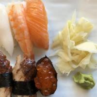 Sushi & Sashimi Dinner · Nigiri - tuna, salmon, shrimp, white tuna, yellowtail, eel. Sashimi - three pieces tuna, two...