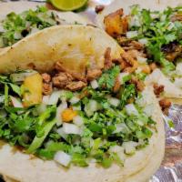 Tacos De Asada · Three tacos of carne asada (seasoned steak),charbroiled and chopped. Served in soft corn tor...