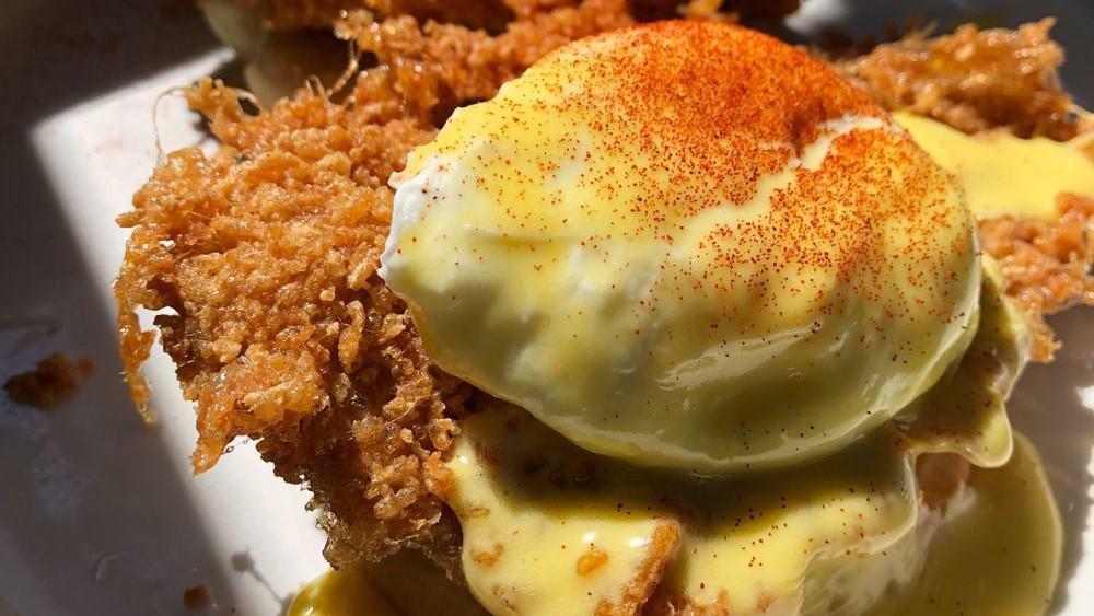 Bumblebee Chickenscratch · Liteful Foods gluten-free biscuit topped with gf fried chicken, mascarpone cheese, honey, poached eggs, and hollandaise. Dusted with paprika.
