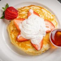 Bananas Foster Pancakes · Two gluten-free pancakes topped with sauteed bananas, spiced rum sauce, and whipped cream. S...