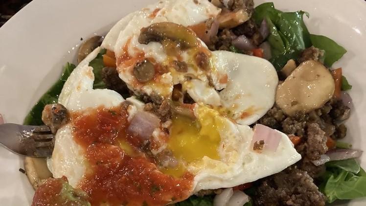 Morning Glory Bowl · Ground buffalo, sauteed with onions, bell peppers and mushrooms. Served on a bed of spinach and topped with two eggs your way, guacamole, and salsa