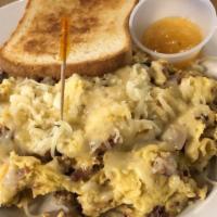 Local Farmer Scramble · An egg scramble filled with bacon, mushrooms, onions, and cheddar cheese. Served with a side...