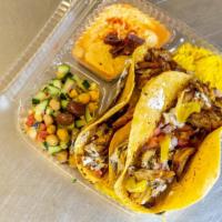 Shawarma Tacos Plate · 2 Tacos your choice Beef, Chicken and falafel served on a corn tortilla.  Comes with rice, h...
