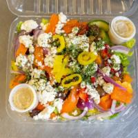 Greek Salad · Vegan. Lettuce, tomato, cucumbers, feta cheese, olives & house dressing.