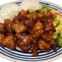 Orange Chicken · Crispy, deep-fried chicken coated in a sweet, orange sauce. Comes with two scoops of steamed...