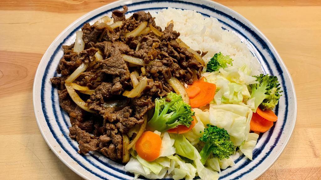 Beef Teriyaki · Korean style marinated beef stir-fried with onions. Comes with two scoops of steamed rice and steamed vegetables.