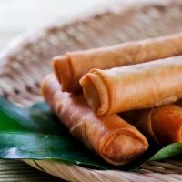 Egg Roll (6Pcs) · 6 pieces of deep-fried homemade vegetable egg rolls (spring rolls). Served with sweet and so...