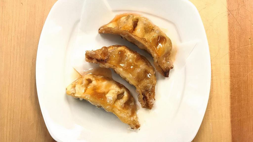 Gyoza (3 Pcs) · 3 pieces of deep-fried gyoza (chicken and vegetable potstickers). Served with sweet and sour sauce.