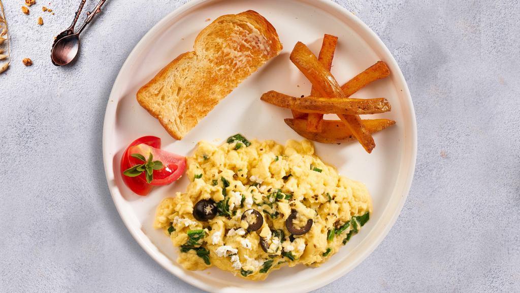 Poblano Huevos · Two eggs scrambled with roasted poblano and onions, topped with melted jack cheese.