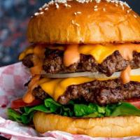 Dbl Trouble Cheeseburger W/Fries · Double Beyond Meat patty, vegan cheese, pickles, Badazz burger sauce, brioche bun. Served wi...
