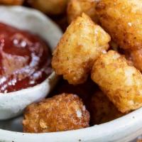 Thotty Tater Tots · Cajun style tots served with ketchup.