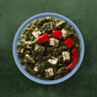 Green Cottage Curry · Indian cottage cheese cooked with fresh spinach and Indian herbs and spices and cream.