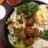 Mediterranean Falafel  · Mediterranean falafel pita  (warm pita filled with traditional falafels, hummus, onion and m...
