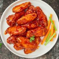 Mild Wings · Fresh chicken wings breaded, fried until golden brown, and tossed in mild sauce. Served with...