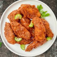 Hot Wings · Fresh chicken wings breaded, fried until golden brown, and tossed in hot sauce. Served with ...