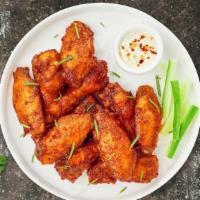 Boneless Classic Wings · Fresh boneless chicken wings breaded and fried until golden brown. Served with a side of ran...
