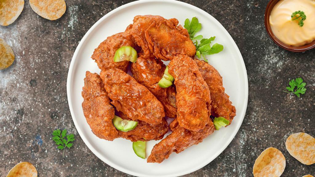 Boneless Hot Wings · Fresh boneless  chicken wings breaded, fried until golden brown, and tossed in hot sauce. Served with a side of ranch or bleu cheese.