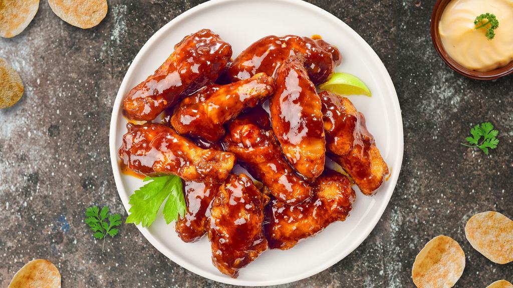 Boneless Bbq Wings · Fresh boneless chicken wings breaded, fried until golden brown, and tossed in barbecue sauce. Served with a side of ranch or bleu cheese.