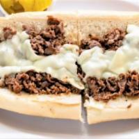 Cheesesteak · Sliced pieces of beef steak topped with melted cheese, served in a long hoagie roll.