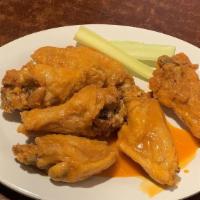 Bone-In Wings · Served with celery sticks and your choice of ranch, blue cheese or honey mustard dressing.