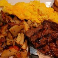Steak & Eggs · Six oz. sirloin steak, two eggs, served with breakfast potatoes or grits, and toast.