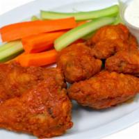 Hot Wings · 6 Crispy chicken wings , with your choice of Ranch or BBQ side sauce , accompanied with fres...