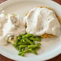 Chicken Fried Steak · Made with black angus beef. Covered in brown or country gravy with mashed potatoes, vegetabl...