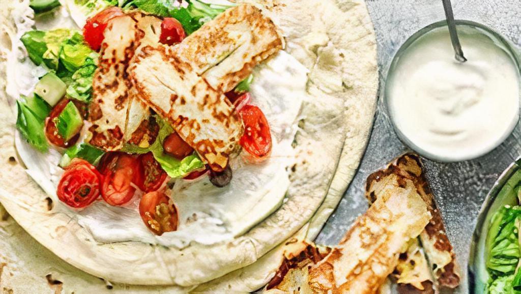 Halloumi Cheese Wrap · Grilled Halloumi cheese, lettuce, tomato, garlic, and cocktail sauce - V