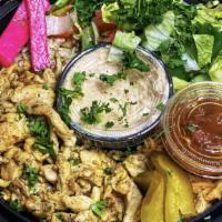 Chicken Shawarma Bowl · Thinly sliced marinated chicken served with rice, salad, hummus and pita bread.