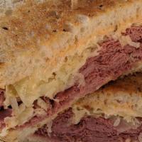 Reuben · A heaping portion of corned beef or pastrami with sauerkraut and melted Swiss served on gril...