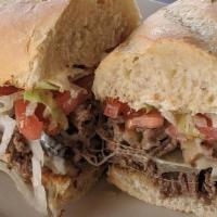 Steak Sub · Thinly sliced tender steak served with sautéed onions, mushrooms, lettuce, tomato, mayo and ...