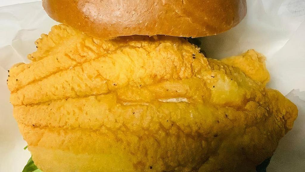 Fried Catfish Sandwich · Fresh Catfish filets, hand-battered & fried to a golden crisp. Top it with Slaw or Dress it your way! Served W/Cajun Fries.