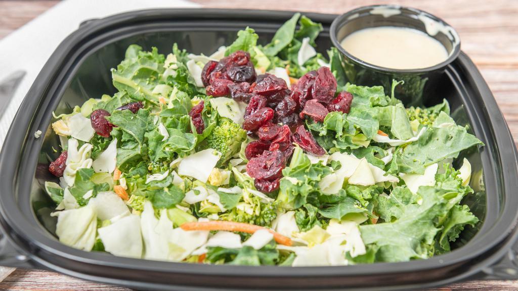 Super Food Salad · Packed with six superfoods including kale, Brussel sprouts, broccoli, cabbage and carrots tossed in our tangy Honey-Lime dressing. Served over lettuce mix with queso fresco and topped with sun-dried cranberries.