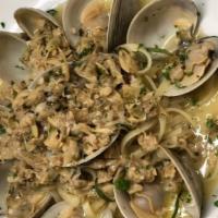 Pasta Vongole · Littleneck and baby clams sautéed in olive oil and fresh garlic. Tossed with linguine, choic...