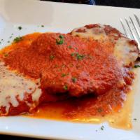 Pollo Parmigiana · Oven baked breaded fried chicken cutlet with our homemade marinara sauce and mozzarella chee...