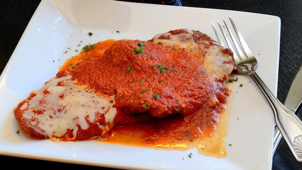 Pollo Parmigiana · Oven baked breaded fried chicken cutlet with our homemade marinara sauce and mozzarella cheese.