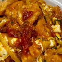 Pollo Alla Bella · Chicken pieces sautéed with sun-dried tomatoes, fried eggplant and fresh mozzarella cheese w...