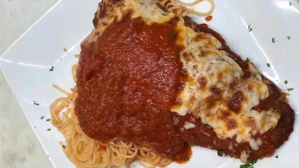 Veal Parmigiana · Oven baked, breaded and fried veal cutlet with our homemade marinara sauce and mozzarella cheese.