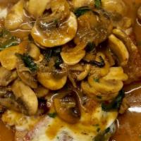 Veal Saltimbocca · Veal scallopine sauteed with shallots, mushrooms, spinach, and fresh sage, topped with prosc...