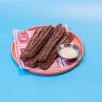 Churros* · fried pastry dough with cinnamon sugar served with condensed milk