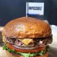 Single Impossible Burger · Plant-based patty, lettuce, tomato, pickle on a butter brioche bun served with crinkle-cut f...