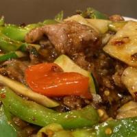 Hunan Spicy Beef · Beef loin strips, zucchini, red bell pepper, jicama, spicy brown sauce.